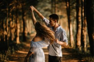couple dancing in the woods