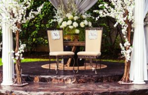 Mr and mrs signs on chairs at a wedding